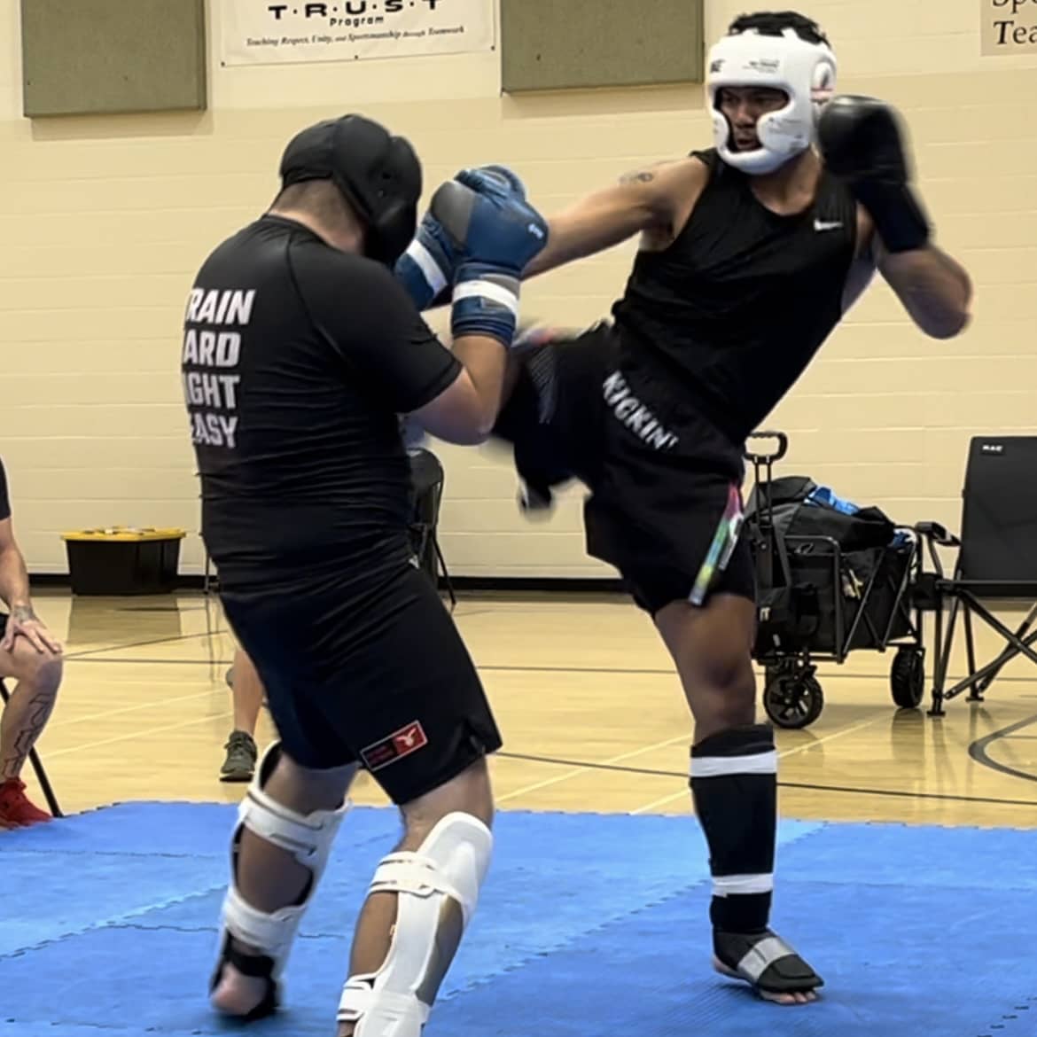 Fighter wearing Kickin' Combat "Technical Deficiencies" high cut gladiator MMA shorts in amateur fight competition