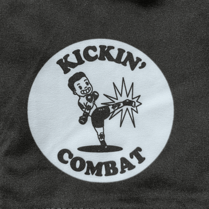 Kickin' Combat "Origins" high cut gladiator MMA shorts logo with retro cartoon fighter throwing roundhouse kick