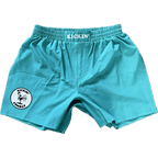 Kickin' Combat "Origins" teal high cut gladiator MMA fight shorts unfolded