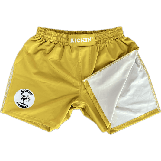 Kickin' Combat "Origins" yellow high cut gladiator MMA shorts folded