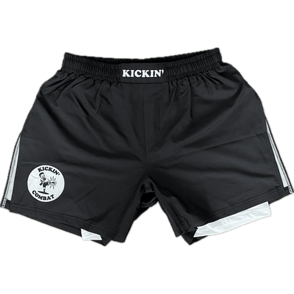 Kickin' Combat "Origins Hybrid" black high cut gladiator MMA shorts with white internal compression layer unfolded