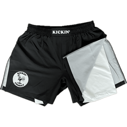 Kickin' Combat "Origins Hybrid" black high cut gladiator MMA shorts with white internal compression layer folded